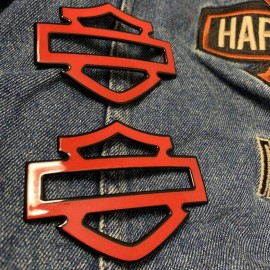 Red with black front outline tank emblems for Harley